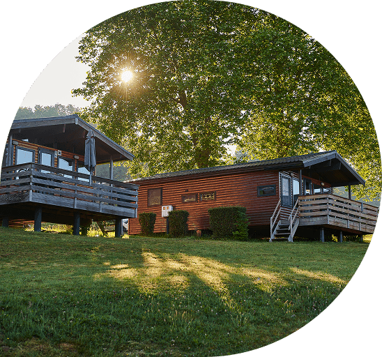 Holiday park accommodations surrounded by nature, representing ResortFlow solutions for resort growth and operations.