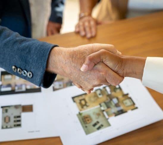 Property owner receiving a payment during a resort management meeting.