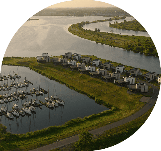 Aerial view of a premium waterside resort representing ResortFlow as a growth partner for holiday parks and resorts.